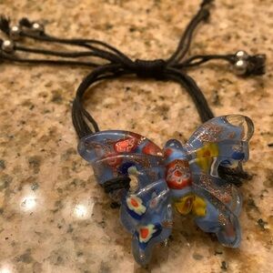 Glass butterfly bracelet.  Adjustable strings  in size.